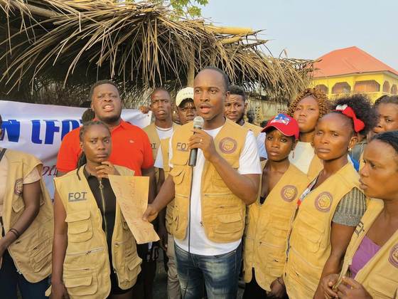 Volunteers gather for a community address
