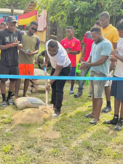 Community members witness the cornerstone laying